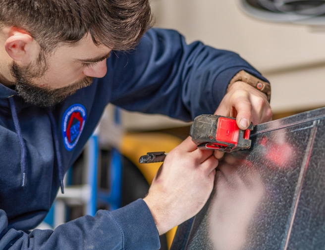 Woman adjusting thermostat